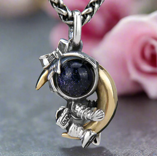 Astronaut Embraces the Moon Charm Pendant
