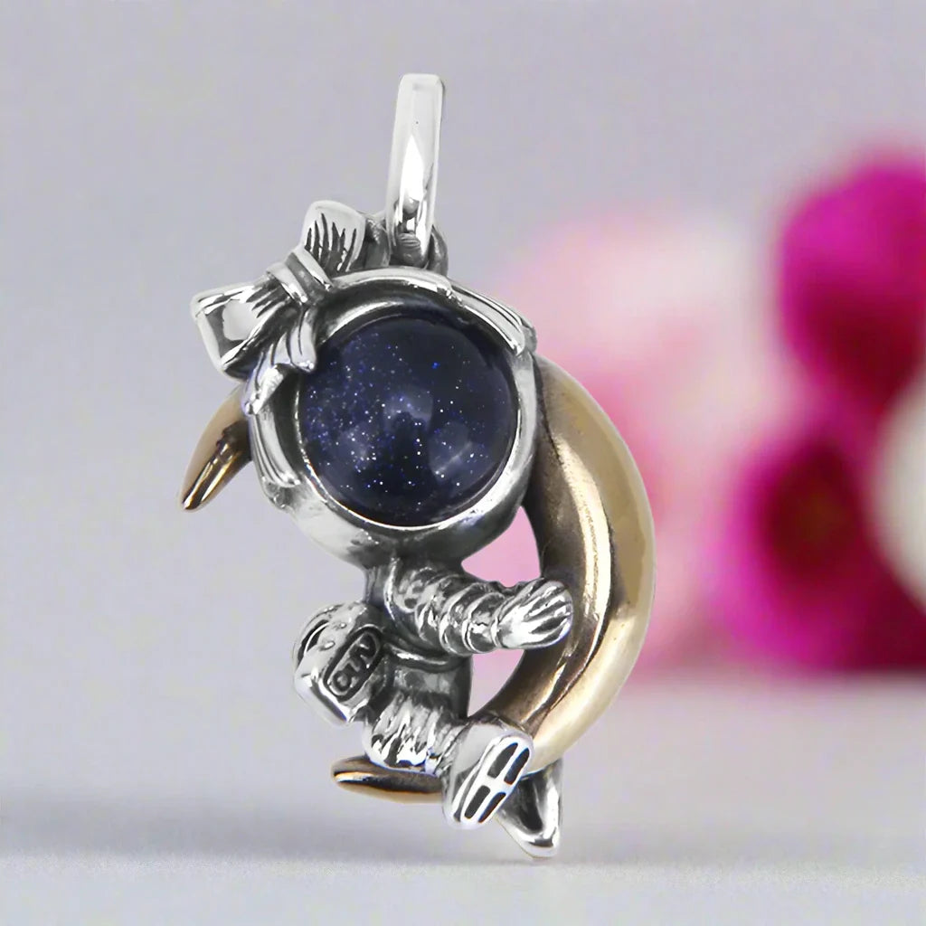 Astronaut Embraces the Moon Charm Pendant