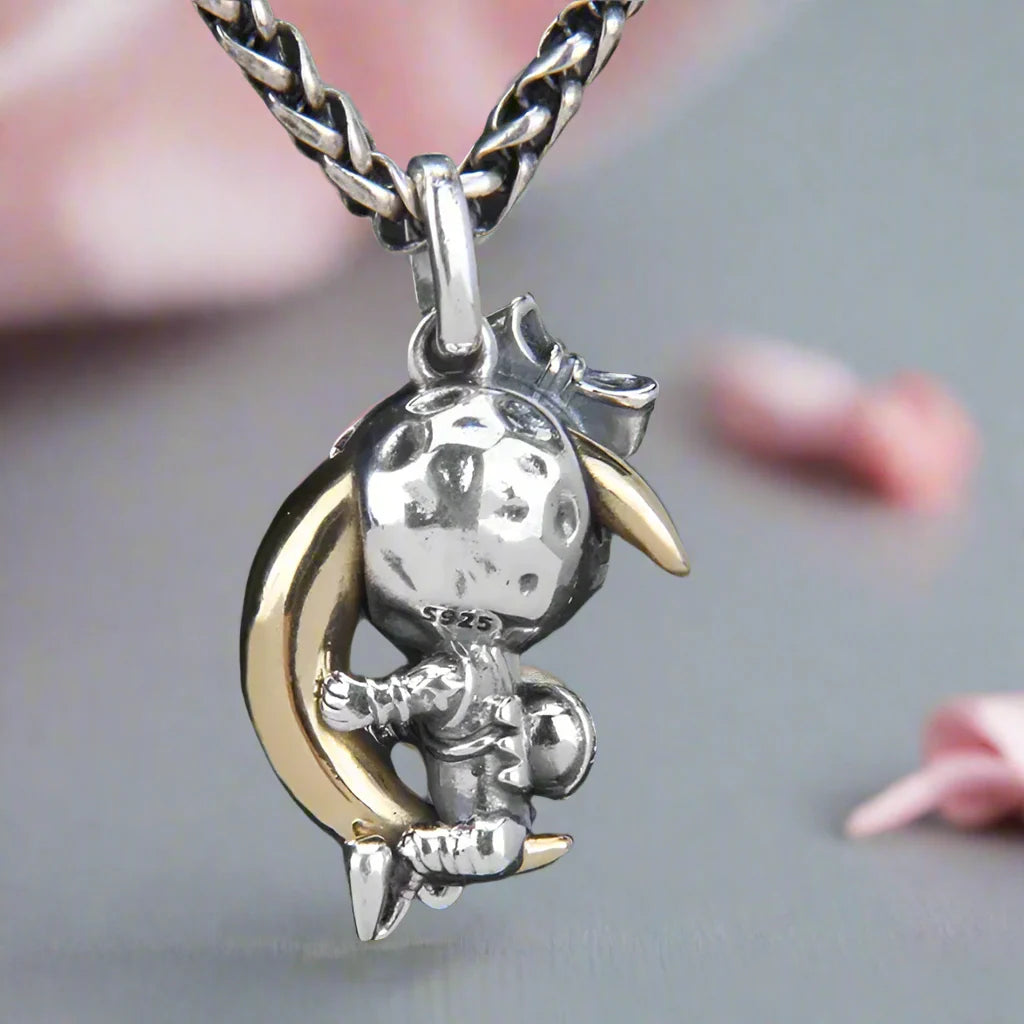 Astronaut Embraces the Moon Charm Pendant