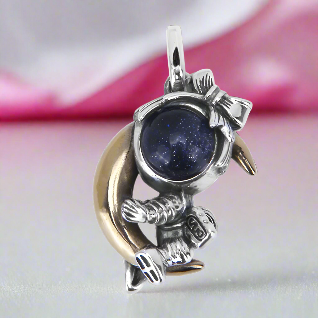 Astronaut Embraces the Moon Charm Pendant