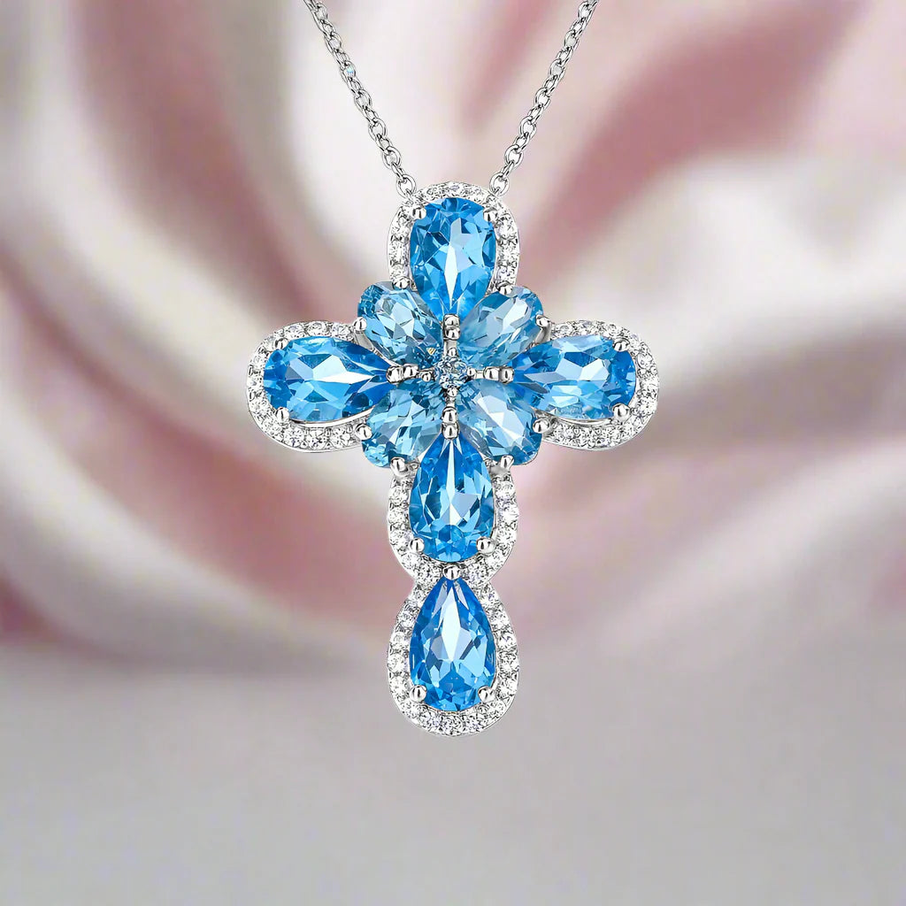 Pear-cut Swiss Blue Halo Cross Necklace